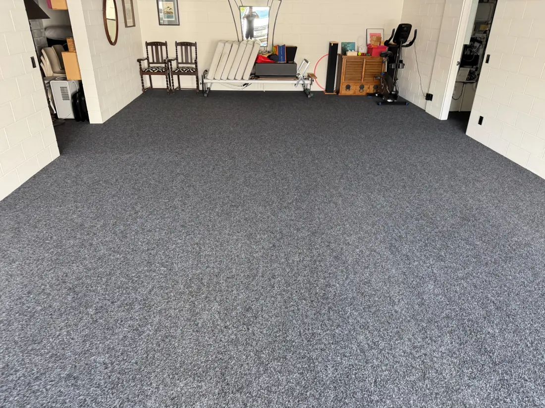 The same Herne Bay garage carpet after cleaning — lighter, with the fleck showing through again