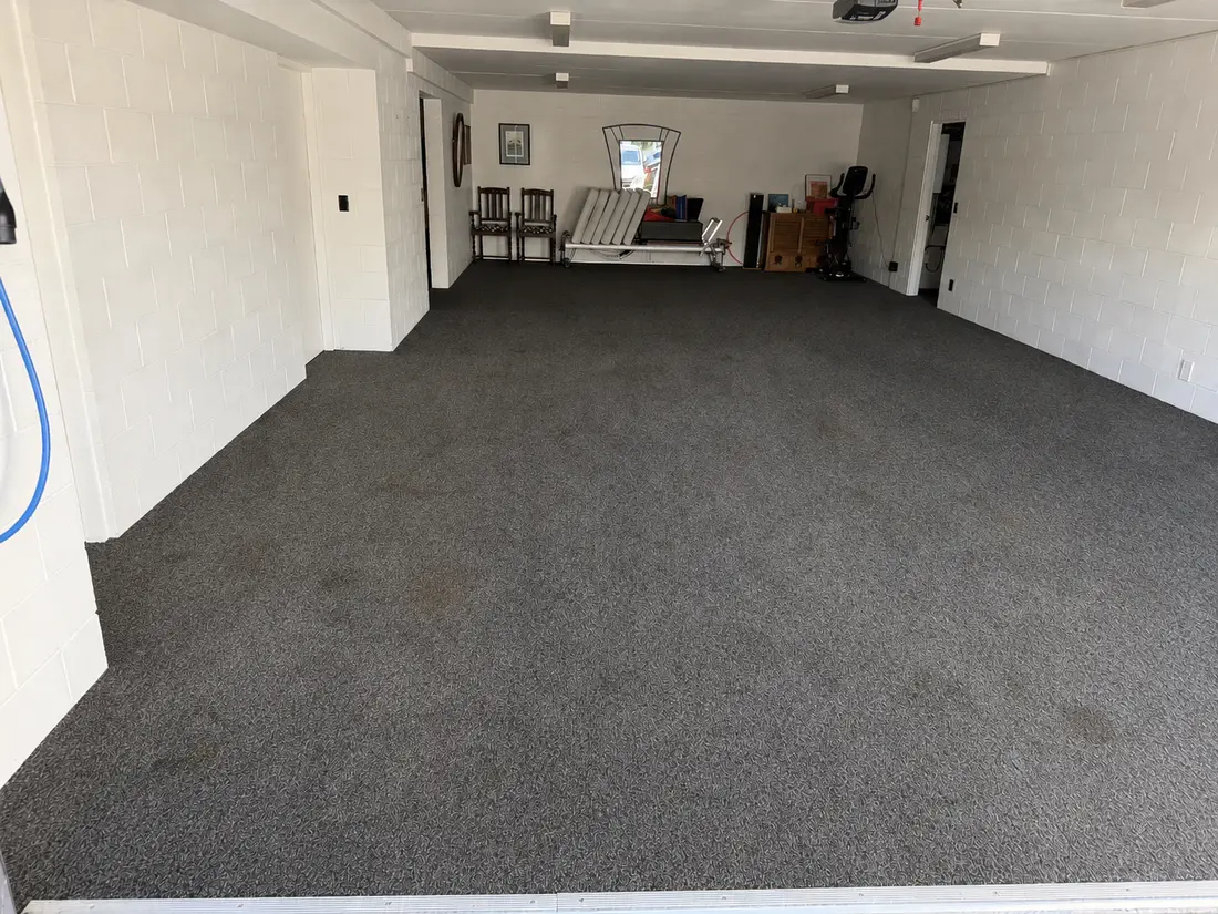 Herne Bay garage carpet before cleaning — dull, with soil sitting in patches across the pile